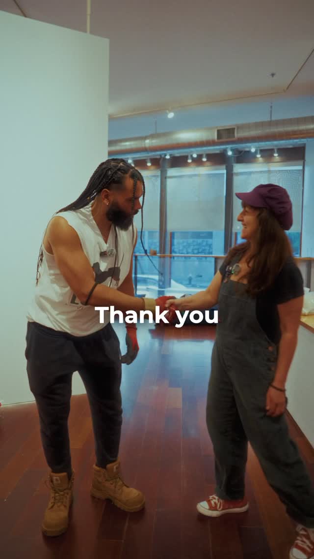 Lola's Moving Co. mover shaking hands with a happy Boston customer after a completed move
